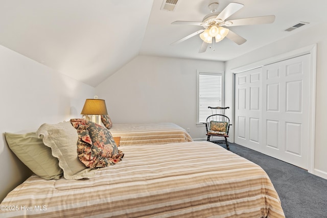 2710 Scarborough Way, Southport, NC 28461 - bedroom with dark carpet, lofted ceiling, a ceiling fan, and a closet