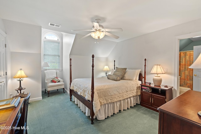 2710 Scarborough Way, Southport, NC 28461 - bedroom with light colored carpet, vaulted ceiling, ceiling fan, and connected bathroom