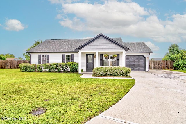 2604 Larne Ct, Wilmington, NC 28411 - view of front of house featuring a garage, driveway, and a shingled roof