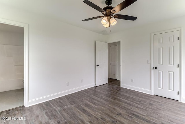 2604 Larne Ct, Wilmington, NC 28411 - unfurnished bedroom featuring dark wood-style floors, connected bathroom, and a ceiling fan