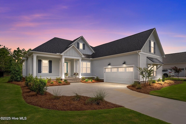 523 Trisail Ter, Wilmington, NC 28412 - modern farmhouse style home featuring board and batten siding, driveway, a garage, a porch, and a yard