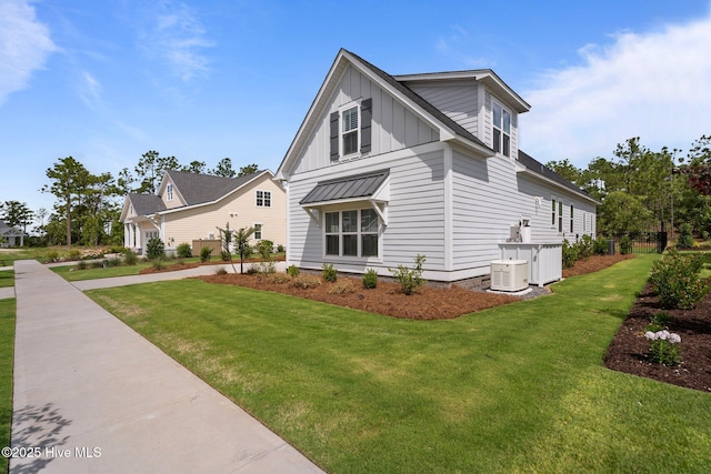 523 Trisail Ter, Wilmington, NC 28412 - view of side of property featuring board and batten siding and a yard