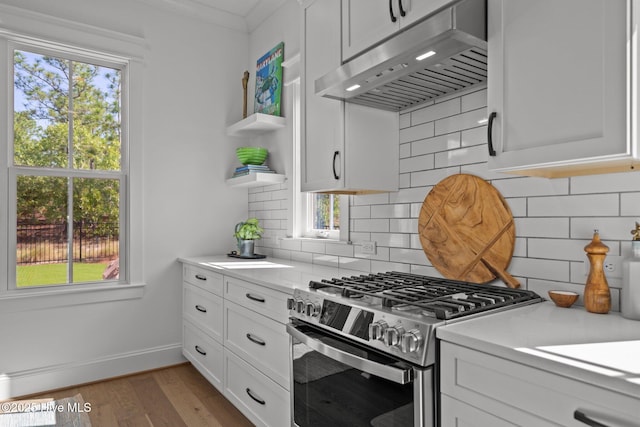 523 Trisail Ter, Wilmington, NC 28412 - kitchen featuring gas stove, under cabinet range hood, open shelves, light countertops, and white cabinetry
