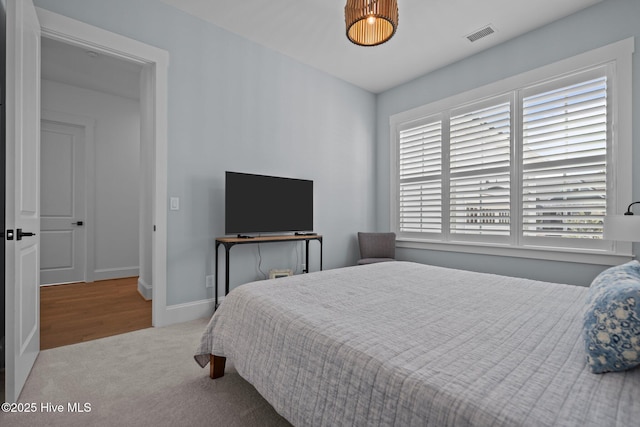 523 Trisail Ter, Wilmington, NC 28412 - carpeted bedroom featuring baseboards