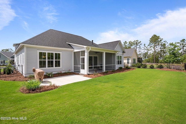 523 Trisail Ter, Wilmington, NC 28412 - rear view of property featuring a patio area, a sunroom, ceiling fan, and roof with shingles