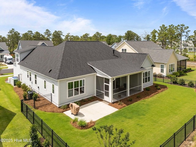 523 Trisail Ter, Wilmington, NC 28412 - rear view of house with roof with shingles, a patio, a sunroom, and a fenced backyard