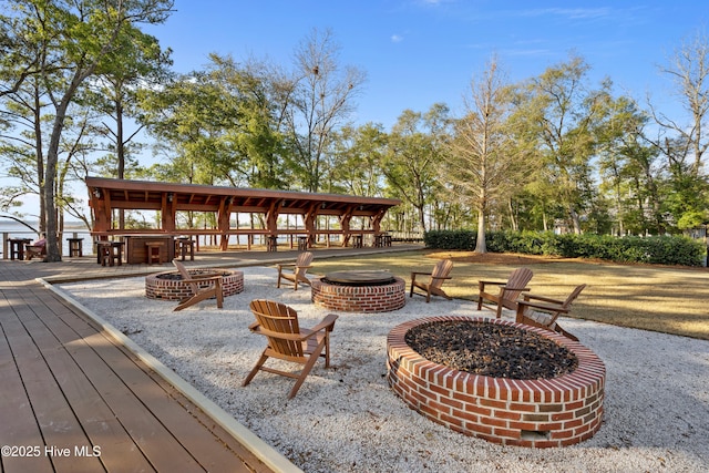 523 Trisail Ter, Wilmington, NC 28412 - view of patio / terrace featuring an outdoor fire pit and a deck
