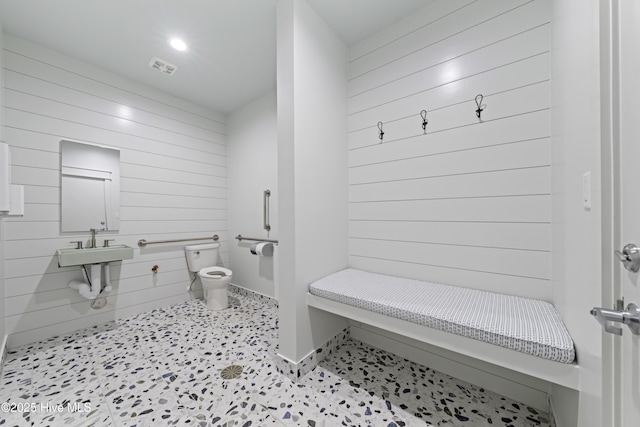 207 Spartanburg Ave Unit 2, Carolina Beach, NC 28428 - bathroom with wooden walls and toilet
