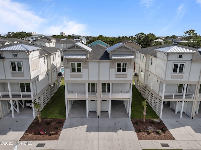 207 Spartanburg Ave Unit 2, Carolina Beach, NC 28428 - rear view of house with a carport, a residential view, and driveway