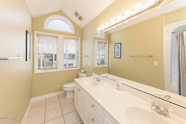 887 Ocean Blvd W, Holden Beach, NC 28462 - bathroom featuring tile patterned floors, vaulted ceiling, and double vanity