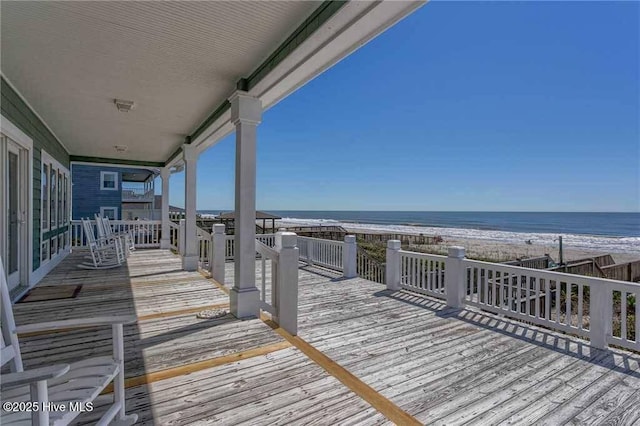 887 Ocean Blvd W, Holden Beach, NC 28462 - wooden deck with view of water and beach