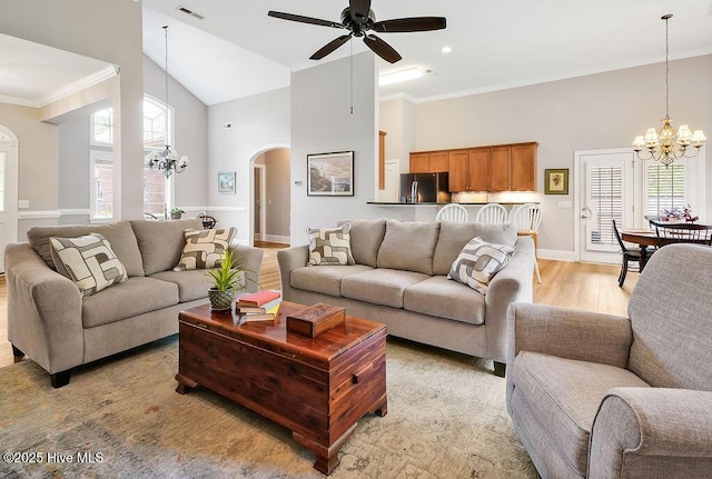 428 Windchime Dr, Wilmington, NC 28412 - living area featuring high vaulted ceiling, a chandelier, arched walkways, ceiling fan, and healthy amount of natural light