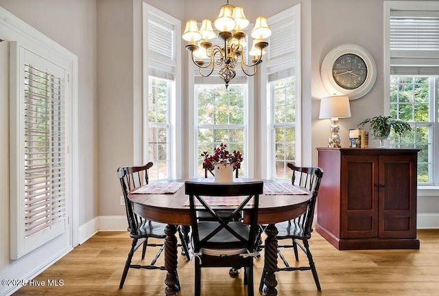428 Windchime Dr, Wilmington, NC 28412 - dining area featuring a chandelier and light wood-style flooring