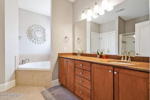 428 Windchime Dr, Wilmington, NC 28412 - full bathroom featuring tile patterned flooring, double vanity, a bath, and a shower stall