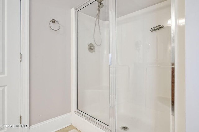 428 Windchime Dr, Wilmington, NC 28412 - full bathroom featuring a stall shower and baseboards
