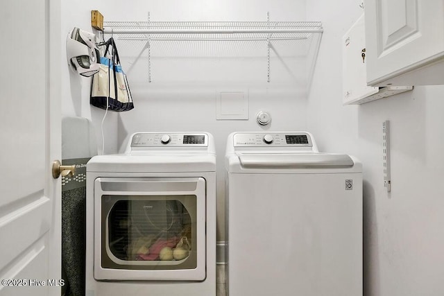428 Windchime Dr, Wilmington, NC 28412 - washroom with washer and clothes dryer and cabinet space