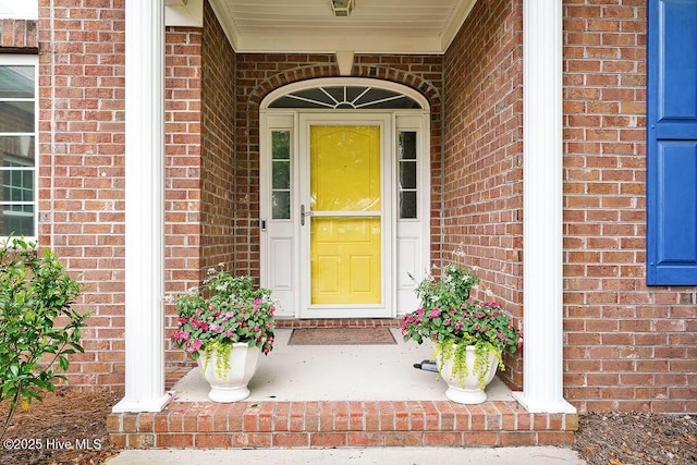 428 Windchime Dr, Wilmington, NC 28412 - doorway to property with brick siding and covered porch