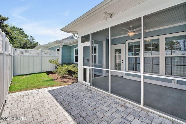 114 W 14th St Unit B, Southport, NC 28461 - fenced backyard with a patio, a sunroom, and ceiling fan