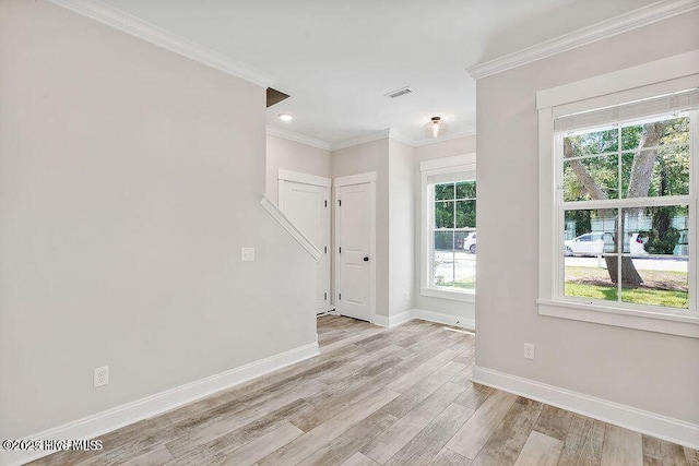114 W 14th St Unit B, Southport, NC 28461 - unfurnished room featuring light wood-style floors, ornamental molding, and recessed lighting