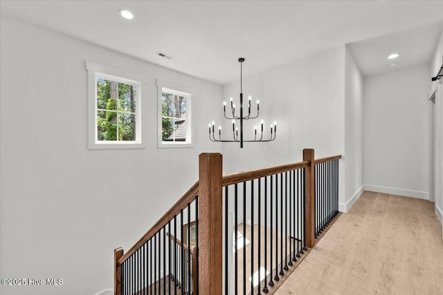 575 E Morganton Rd, Southern Pines, NC 28387 - hall featuring wood finished floors, a chandelier, and recessed lighting