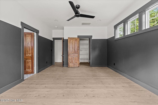 575 E Morganton Rd, Southern Pines, NC 28387 - unfurnished bedroom featuring light wood-type flooring and a ceiling fan