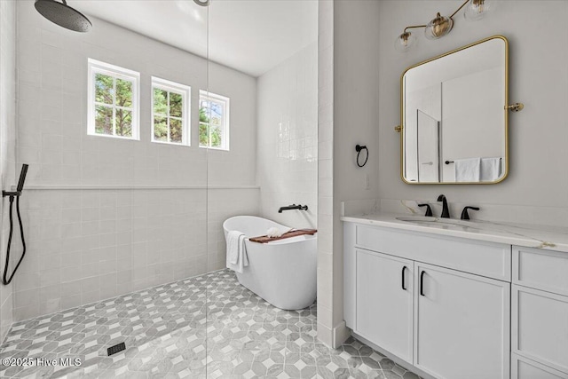 575 E Morganton Rd, Southern Pines, NC 28387 - bathroom featuring a tile shower, a soaking tub, and vanity