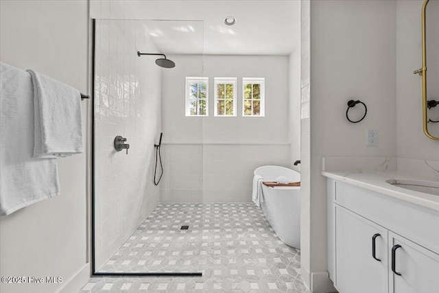 575 E Morganton Rd, Southern Pines, NC 28387 - bathroom featuring a tile shower, a soaking tub, and vanity