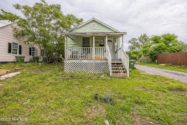 115 Wright St, Wilmington, NC 28401 - shotgun-style home featuring a porch