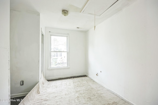 115 Wright St, Wilmington, NC 28401 - unfurnished room featuring attic access and baseboards