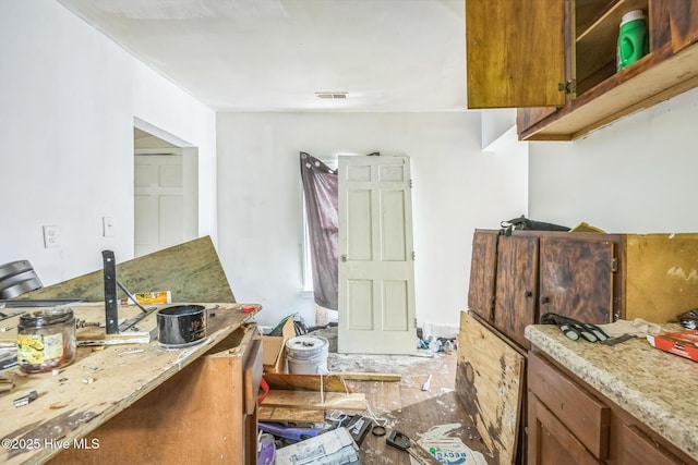 115 Wright St, Wilmington, NC 28401 - kitchen with brown cabinets and light stone countertops