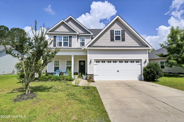 121 Poplar Branch Way, Hampstead, NC 28443 - view of front of home with concrete driveway, covered porch, and a front yard