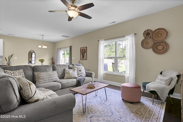 121 Poplar Branch Way, Hampstead, NC 28443 - living area featuring a chandelier, ceiling fan, and wood finished floors