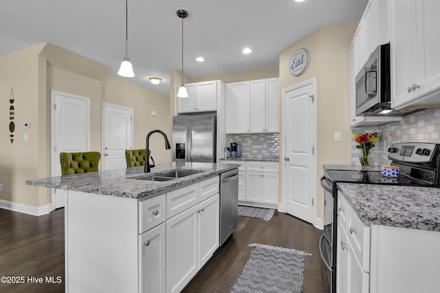 121 Poplar Branch Way, Hampstead, NC 28443 - kitchen featuring stainless steel appliances, recessed lighting, dark wood-style floors, tasteful backsplash, and white cabinetry