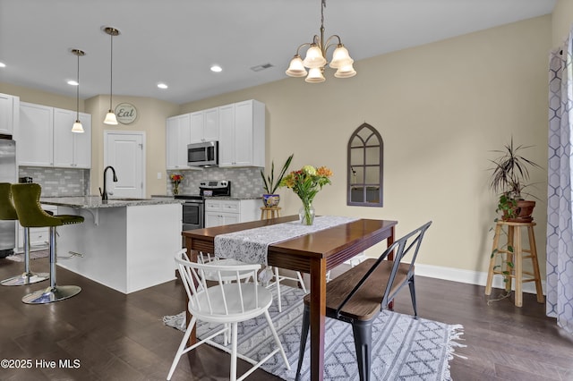 121 Poplar Branch Way, Hampstead, NC 28443 - dining room featuring a chandelier, recessed lighting, and dark wood-style floors