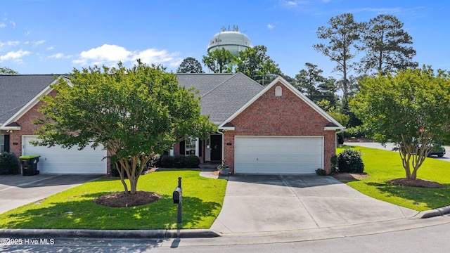 812 Vineyard Dr, New Bern, NC 28562 - traditional-style home with a front yard, concrete driveway, brick siding, and a garage