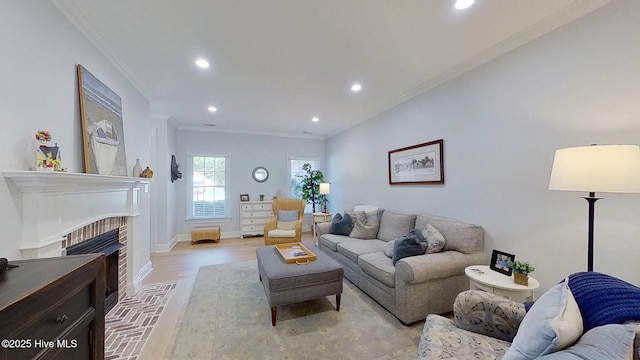 812 Vineyard Dr, New Bern, NC 28562 - living area featuring crown molding, recessed lighting, light wood-style floors, and a brick fireplace