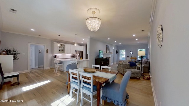 812 Vineyard Dr, New Bern, NC 28562 - dining space featuring ornamental molding, light wood-style floors, a chandelier, and recessed lighting