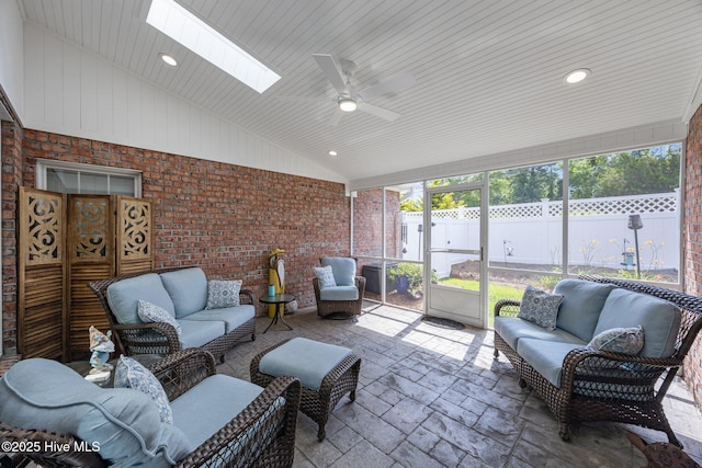 812 Vineyard Dr, New Bern, NC 28562 - sunroom featuring outdoor lounge area, a ceiling fan, a skylight, and vaulted ceiling
