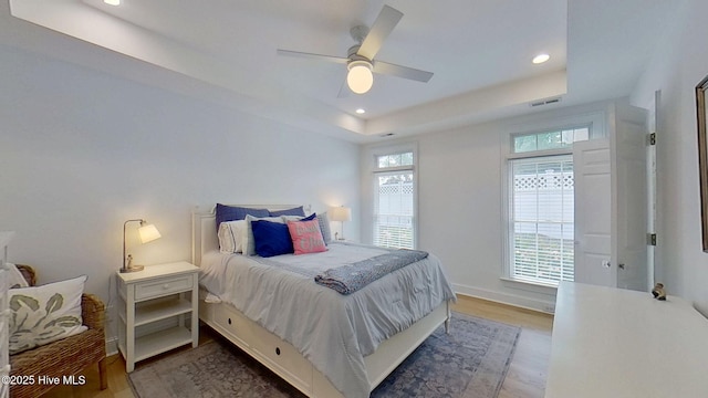812 Vineyard Dr, New Bern, NC 28562 - bedroom featuring a raised ceiling, recessed lighting, wood finished floors, and ceiling fan