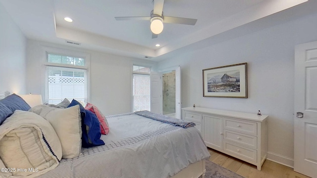 812 Vineyard Dr, New Bern, NC 28562 - bedroom with light wood-style floors, a raised ceiling, recessed lighting, and a ceiling fan