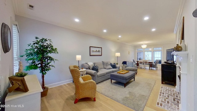 812 Vineyard Dr, New Bern, NC 28562 - living area with light wood finished floors, crown molding, and recessed lighting