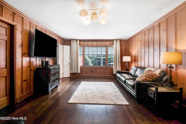 1714 E Walnut St, Goldsboro, NC 27530 - living room featuring dark wood-style flooring, wooden walls, and a chandelier