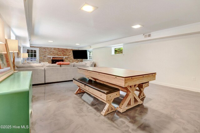 1714 E Walnut St, Goldsboro, NC 27530 - playroom with a fireplace and concrete flooring