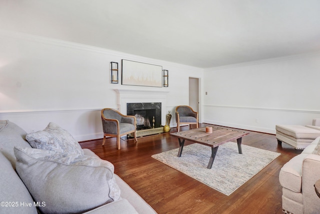 1714 E Walnut St, Goldsboro, NC 27530 - living room with a high end fireplace, crown molding, and dark wood-style flooring