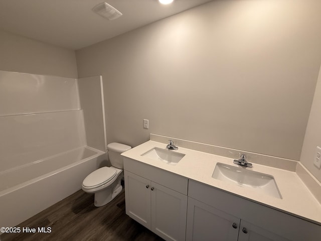 37 Chloe Ct, Selma, NC 27576 - full bathroom featuring double vanity, wood finished floors, and shower / bathtub combination