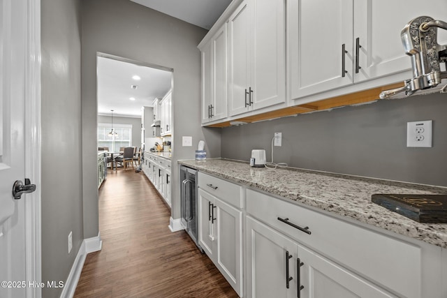 28 Winding Trl, Whispering Pines, NC 28327 - kitchen featuring dark wood-type flooring, white cabinetry, beverage cooler, light stone counters, and recessed lighting