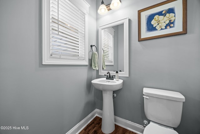 28 Winding Trl, Whispering Pines, NC 28327 - half bathroom with toilet and wood finished floors