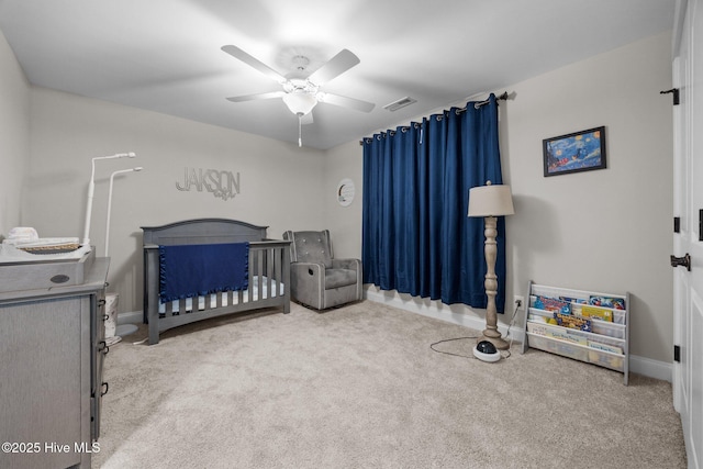 28 Winding Trl, Whispering Pines, NC 28327 - carpeted bedroom with a nursery area and ceiling fan