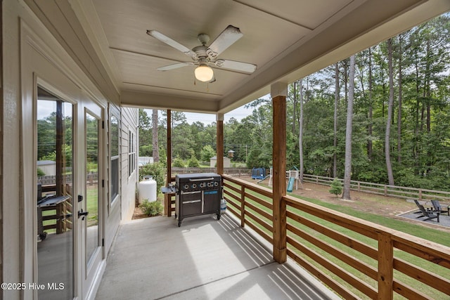 28 Winding Trl, Whispering Pines, NC 28327 - sunroom / solarium featuring a ceiling fan and view of wooded area