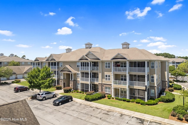 235 Woodlands Way Unit 9, Calabash, NC 28467 - view of building exterior with uncovered parking